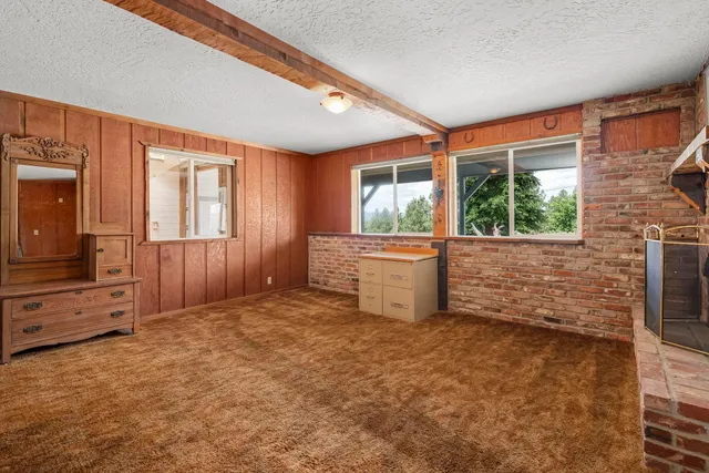 wooden floor in an empty room and a window