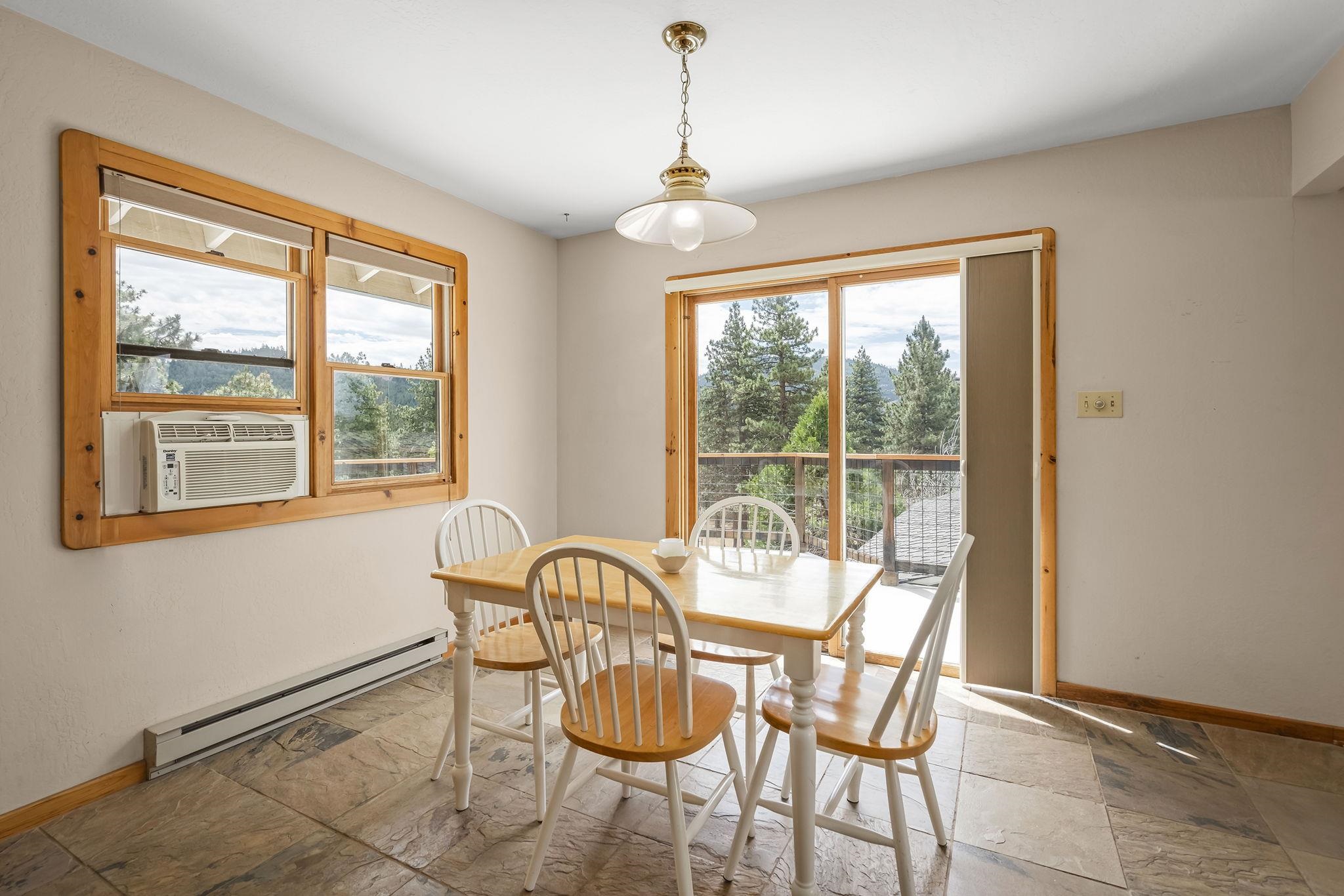 640 Redbud Street Portola, CA 96122 - Photo 9 of 27 a view of a dining room with furniture window and outside view