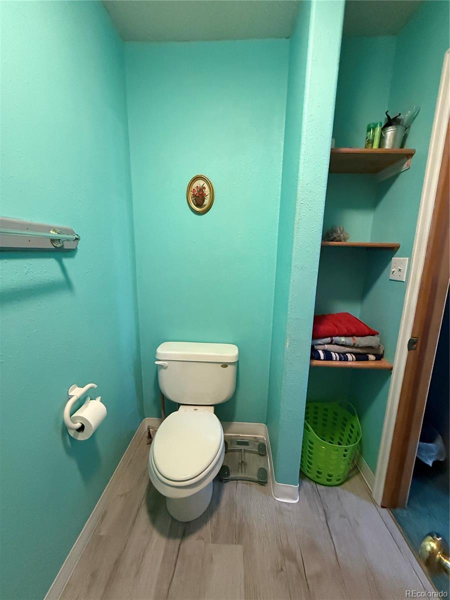 329 6th Street Hugo, CO 80821 - Photo 36 of 50 a bathroom with a toilet and a sink