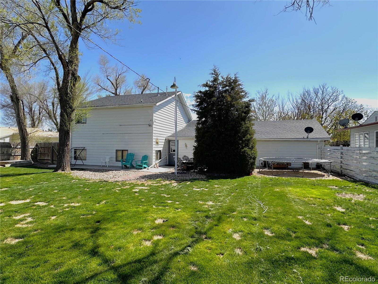 329 6th Street Hugo, CO 80821 - Photo 42 of 50 a view of a house with a yard