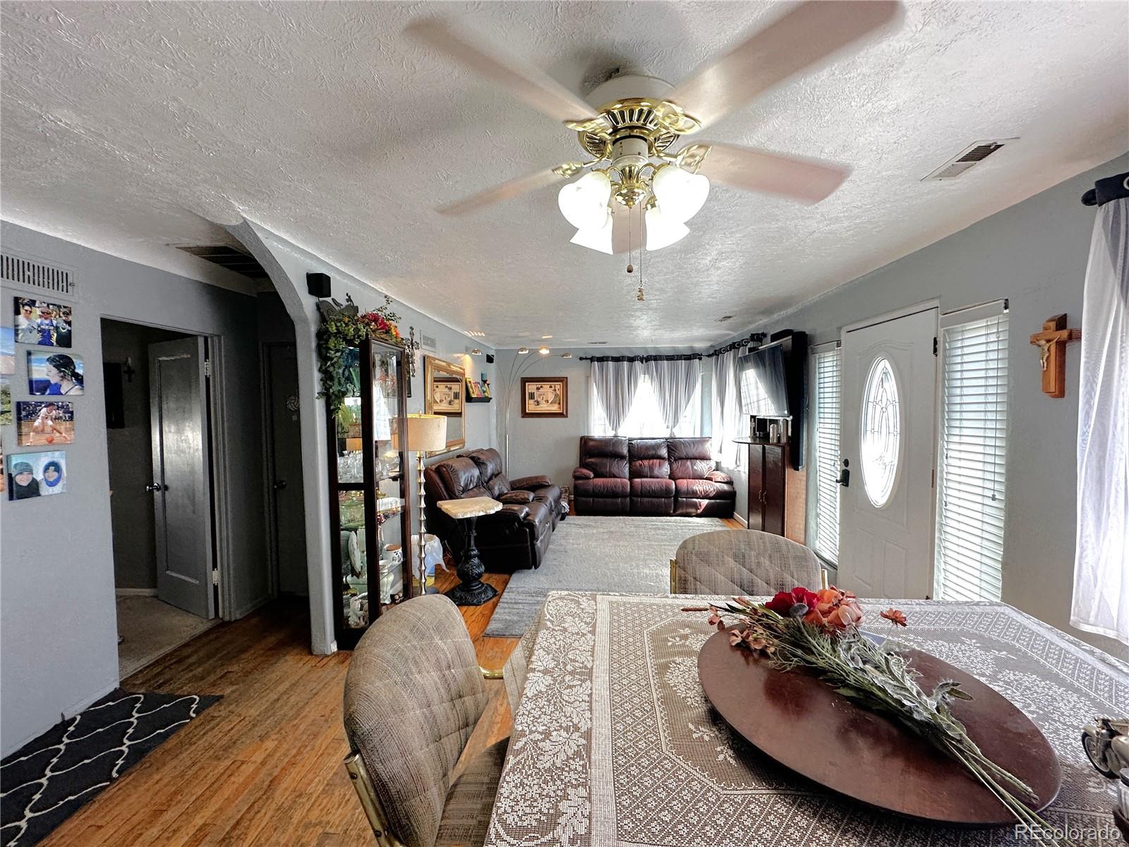 329 6th Street Hugo, CO 80821 - Photo 6 of 50 a living room with furniture and a chandelier