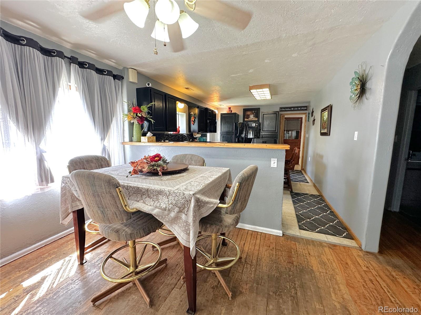 329 6th Street Hugo, CO 80821 - Photo 7 of 50 a view of a dining room with furniture window and wooden floor
