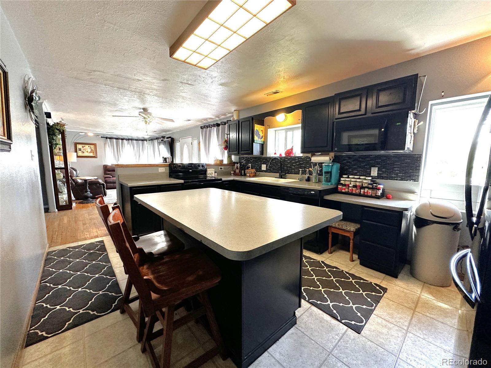329 6th Street Hugo, CO 80821 - Photo 9 of 50 a kitchen with a sink appliances and cabinets