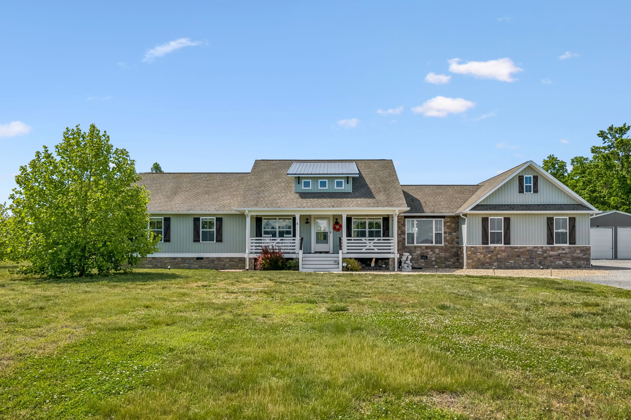 86 Ben Road Westmoreland, TN 37186 - Photo 1 of 64 a view of a house with a big yard and potted plants