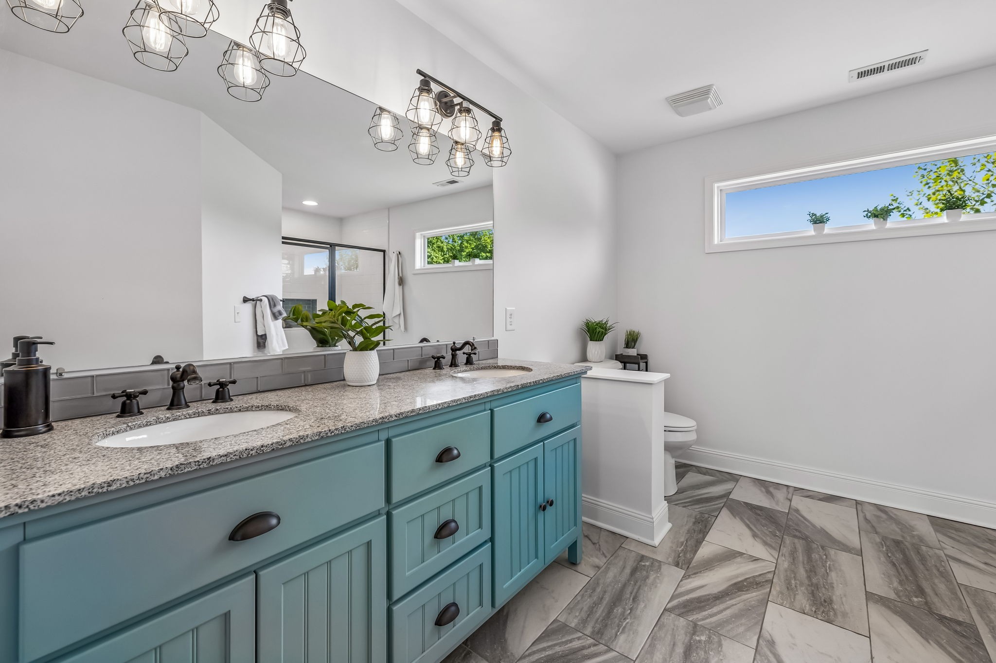 86 Ben Road Westmoreland, TN 37186 - Photo 36 of 64 a spacious bathroom with a granite countertop sink a mirror and a vanity