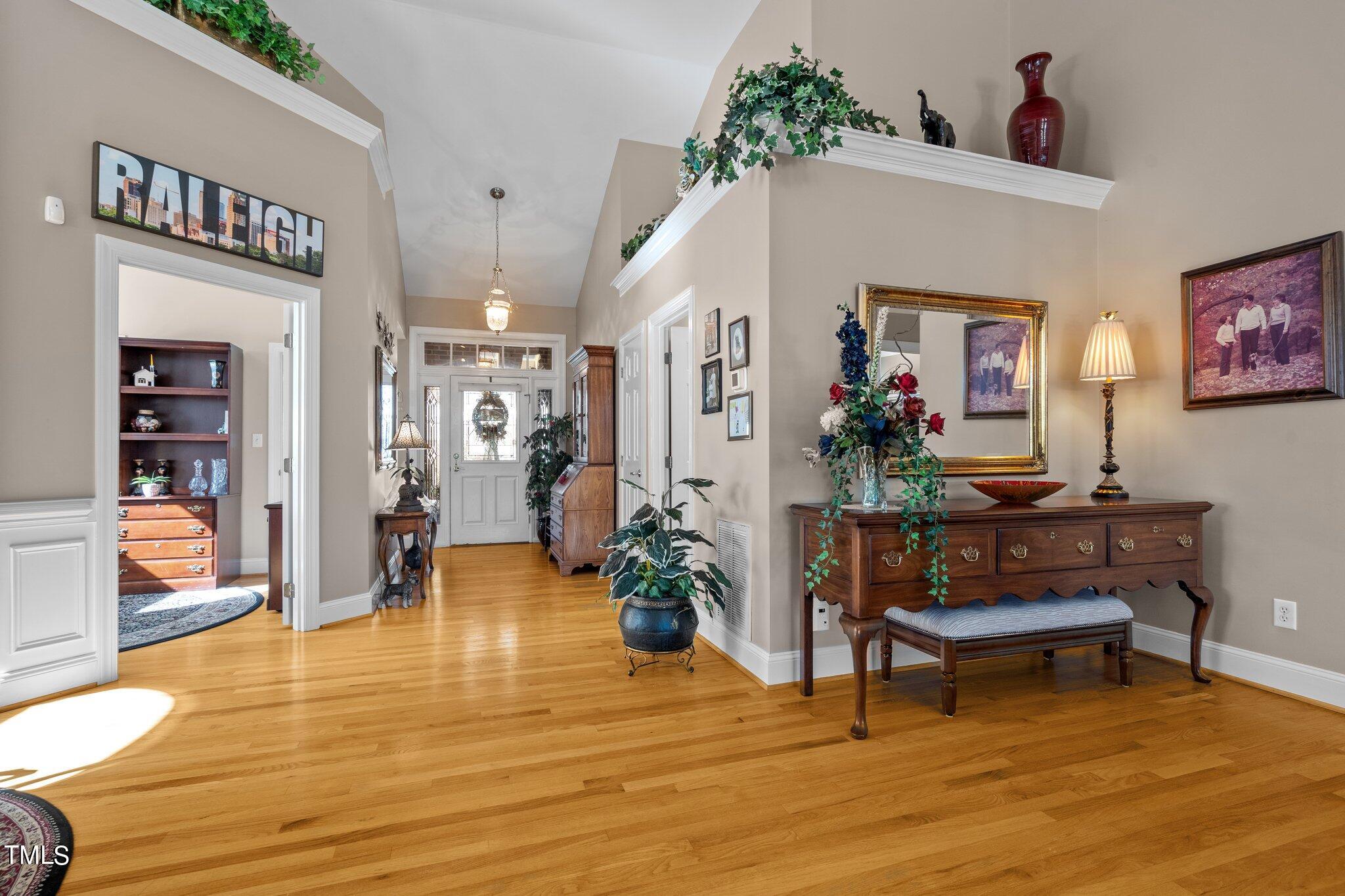 10125 Goodview Court Raleigh, NC 27613 - Photo 15 of 45 a living room with furniture and a table