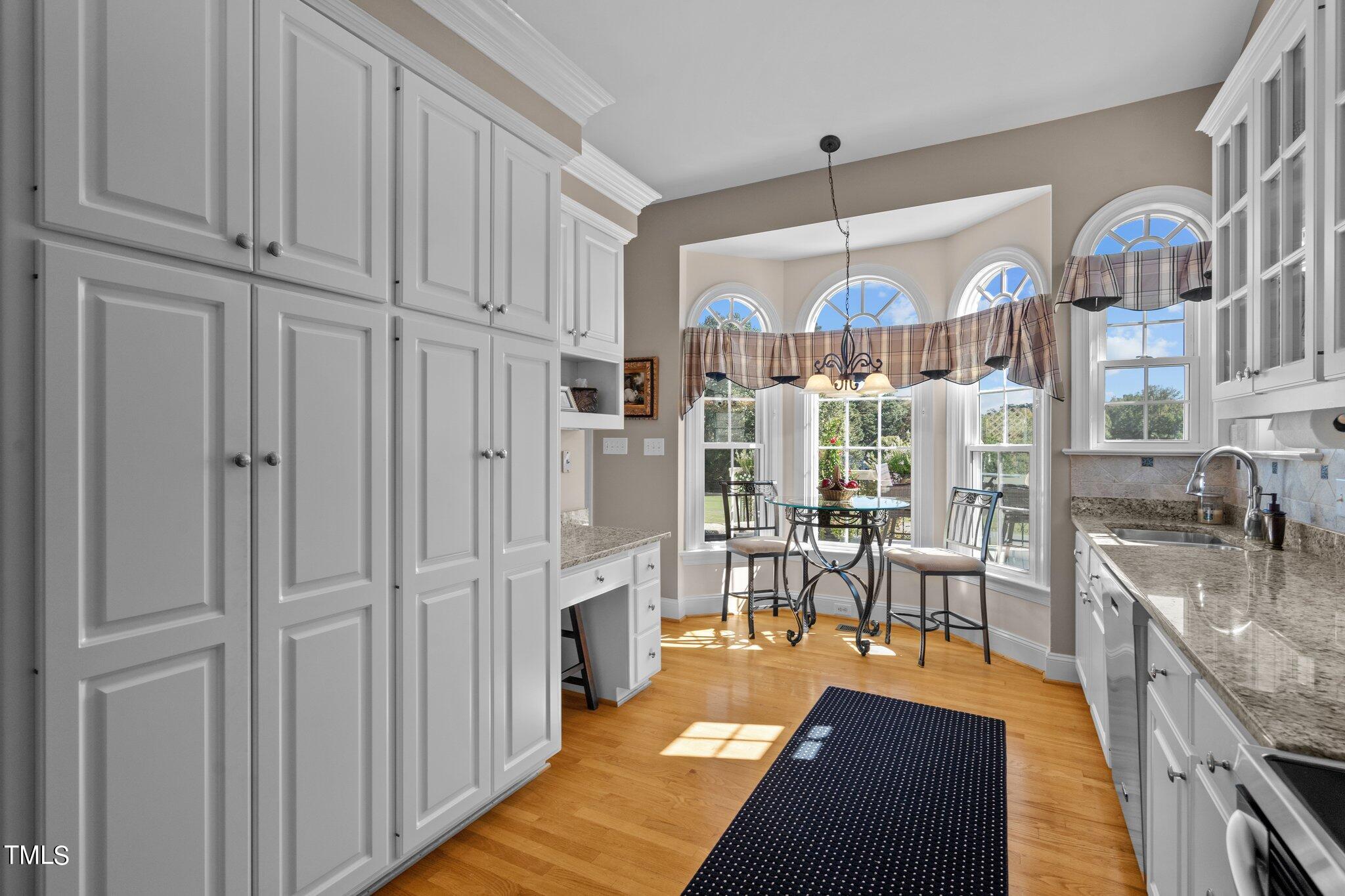 10125 Goodview Court Raleigh, NC 27613 - Photo 18 of 45 a very nice looking dining room with kitchen view