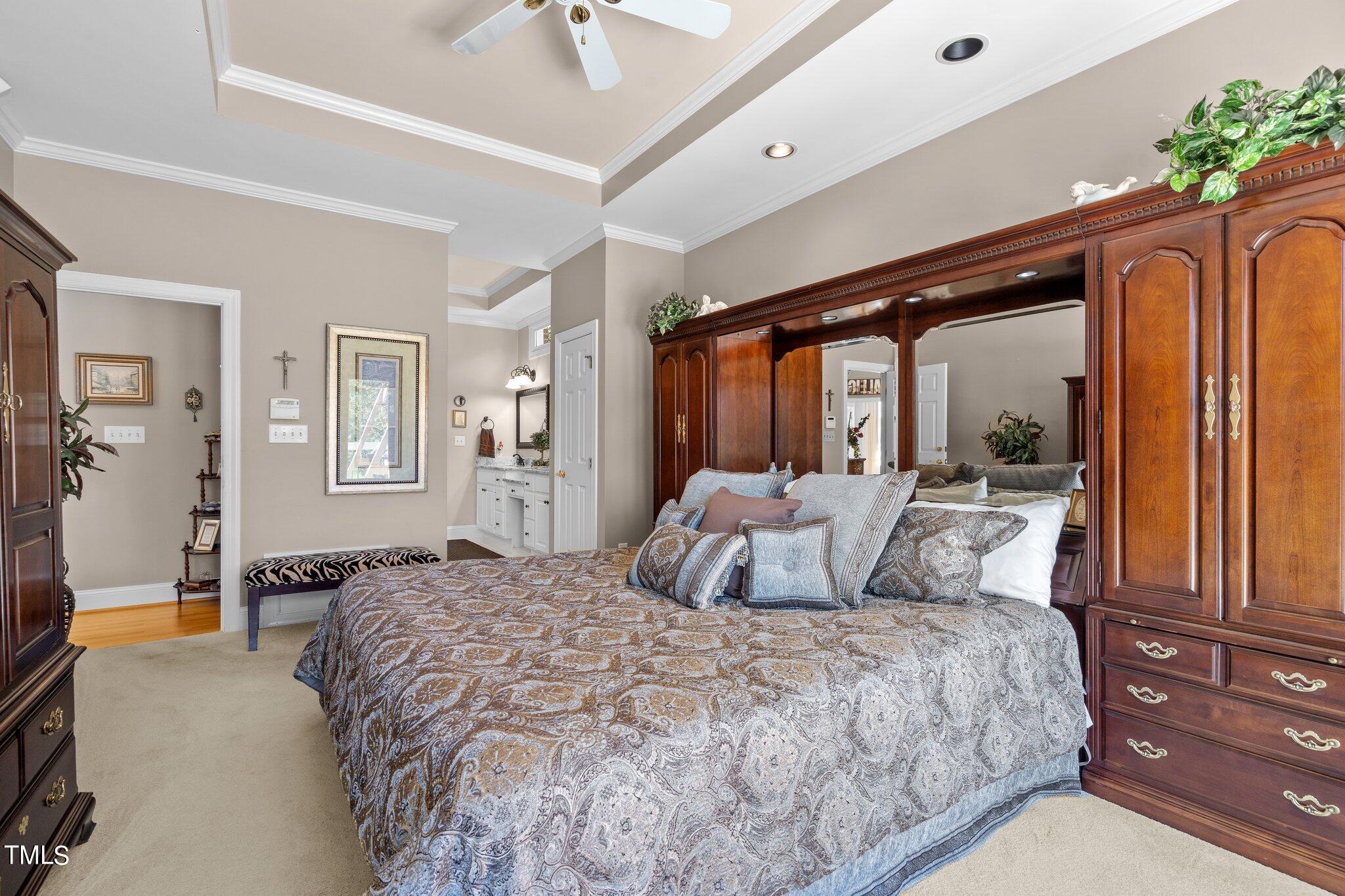 10125 Goodview Court Raleigh, NC 27613 - Photo 24 of 45 a bedroom with a large bed and a large window
