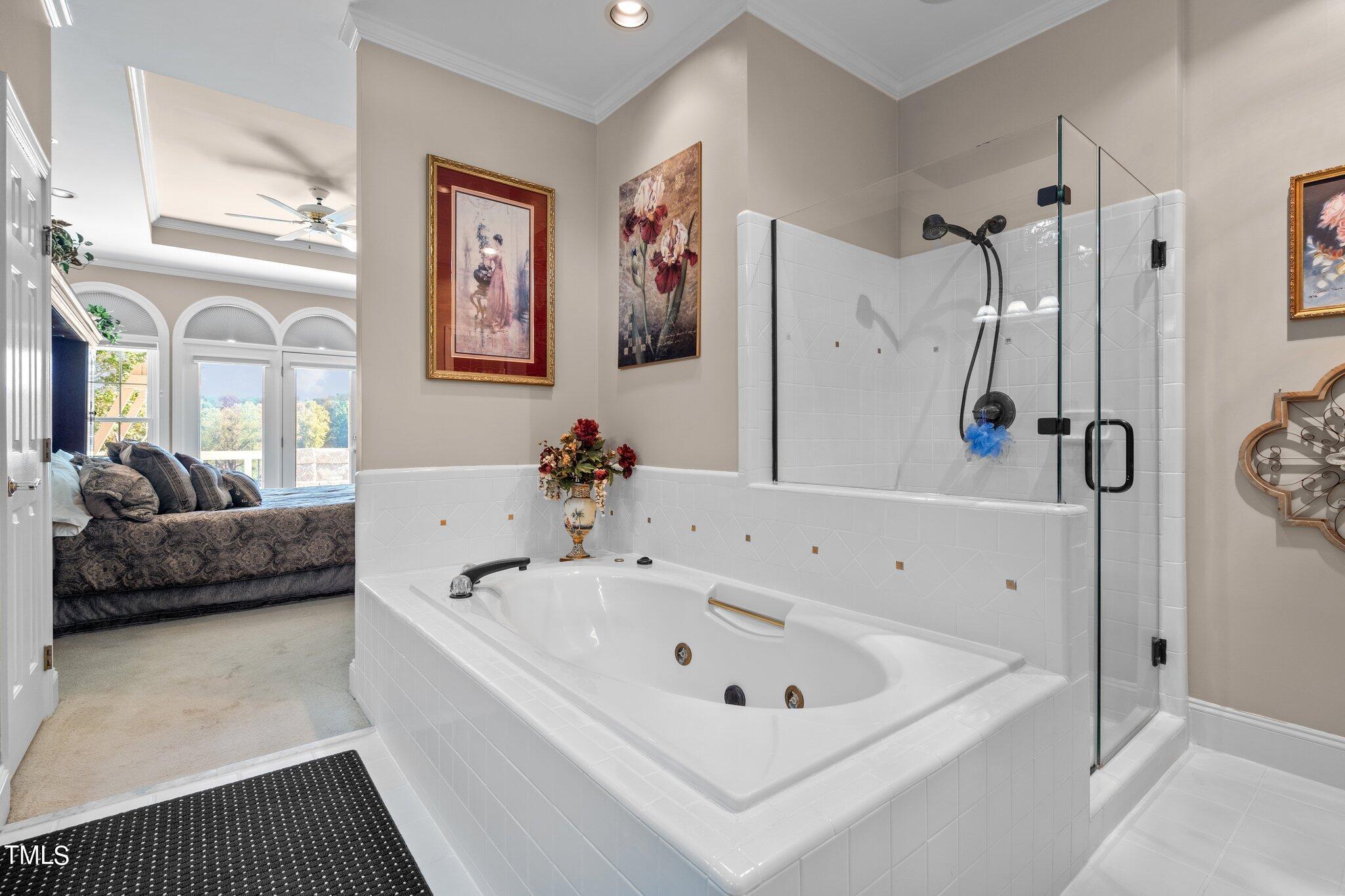 10125 Goodview Court Raleigh, NC 27613 - Photo 27 of 45 a white bath tub sitting next to a bathroom