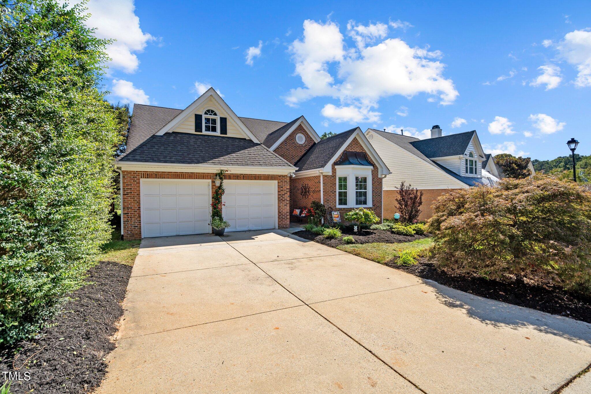 10125 Goodview Court Raleigh, NC 27613 - Photo 29 of 45 a front view of a house with a yard