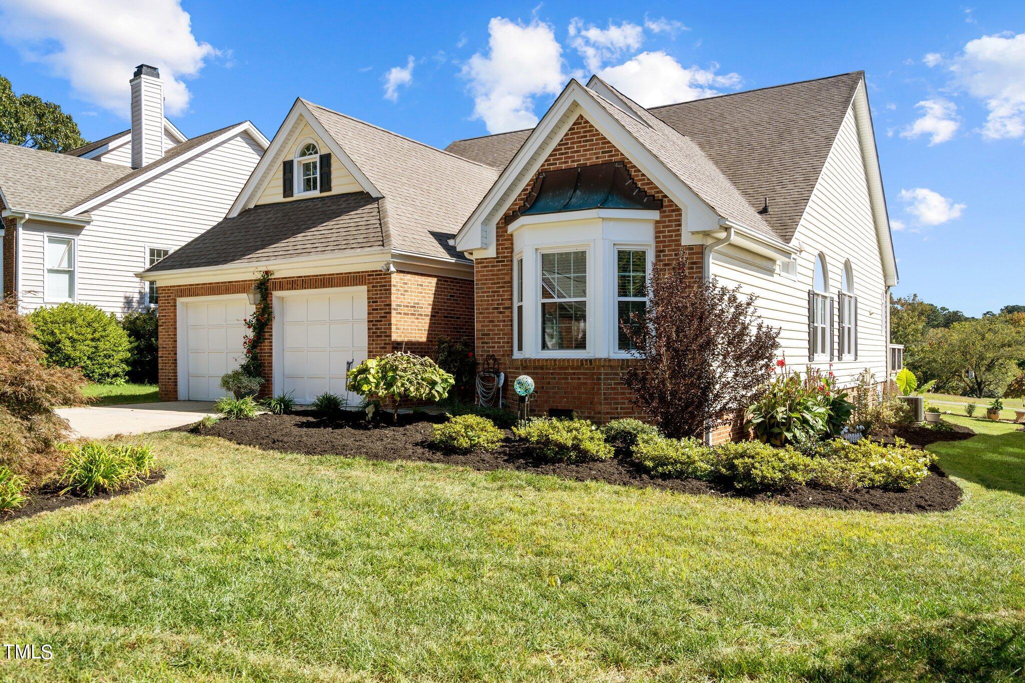 10125 Goodview Court Raleigh, NC 27613 - Photo 3 of 45 a front view of a house with a yard