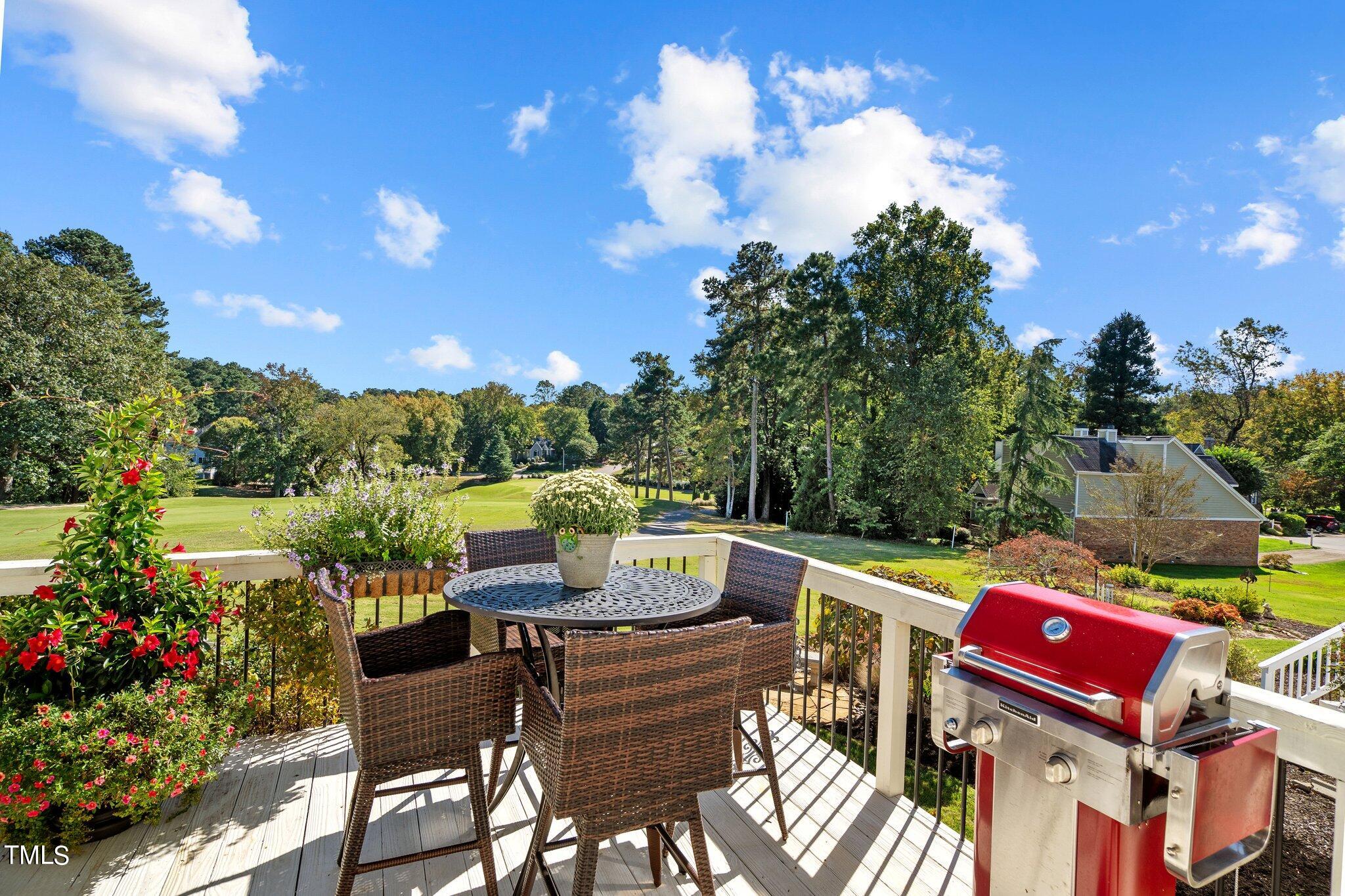 10125 Goodview Court Raleigh, NC 27613 - Photo 33 of 45 a view of a chairs and table in the patio and a garden