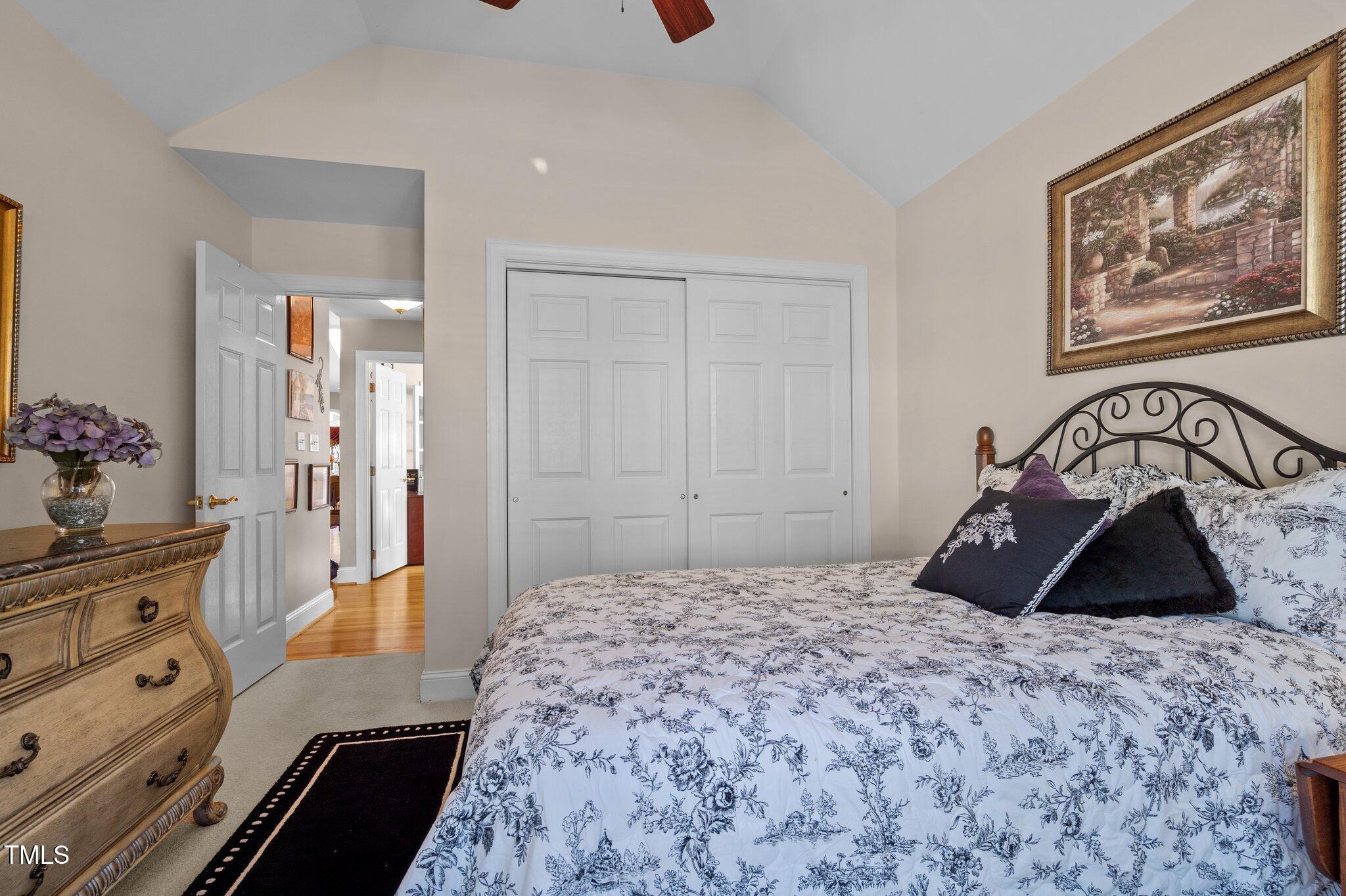 10125 Goodview Court Raleigh, NC 27613 - Photo 6 of 45 a bedroom with a bed and a dresser