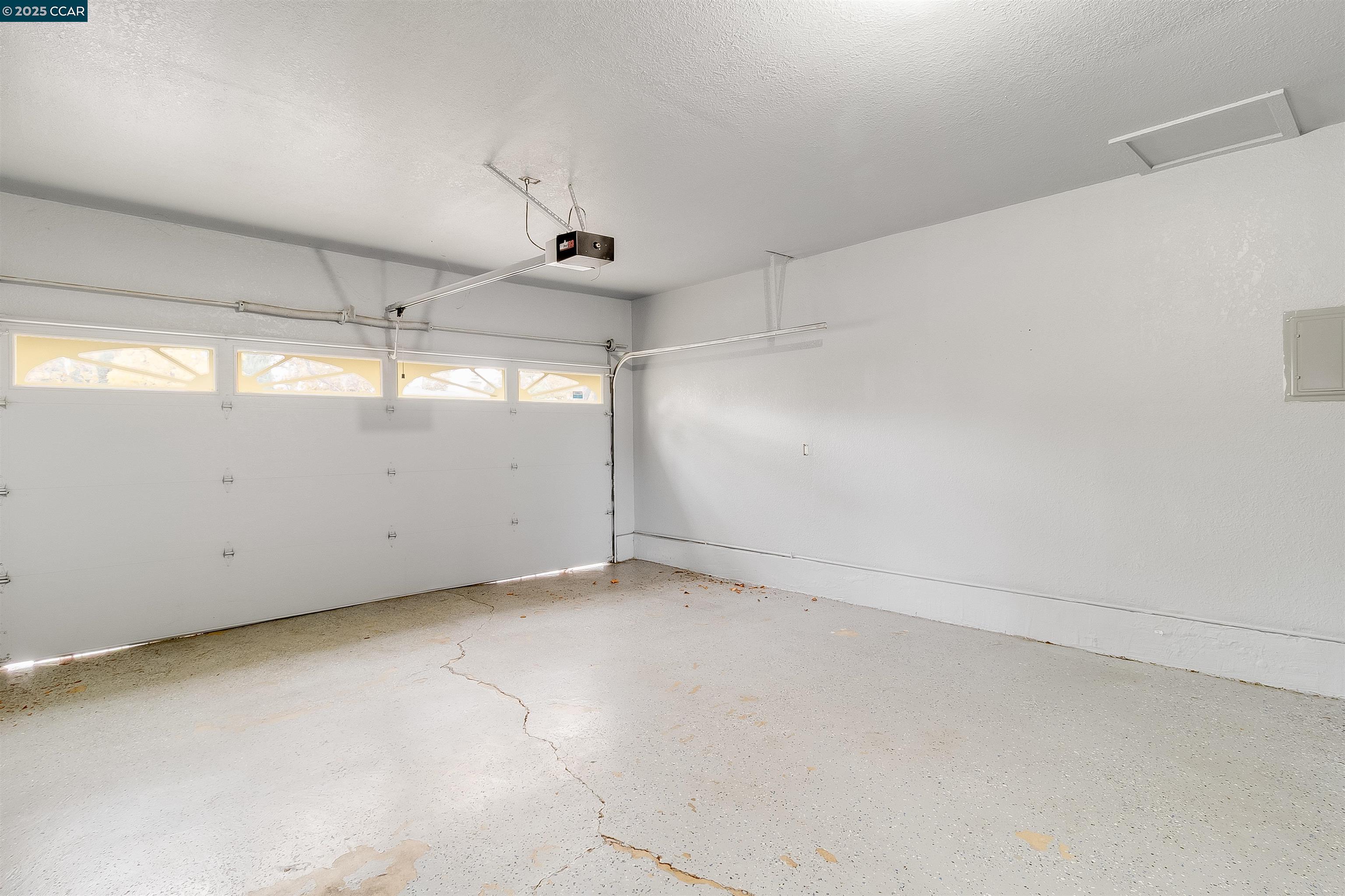 1216 Lincoln Street Fairfield, CA 94533 - Photo 13 of 28 an empty room with a ceiling fan and windows