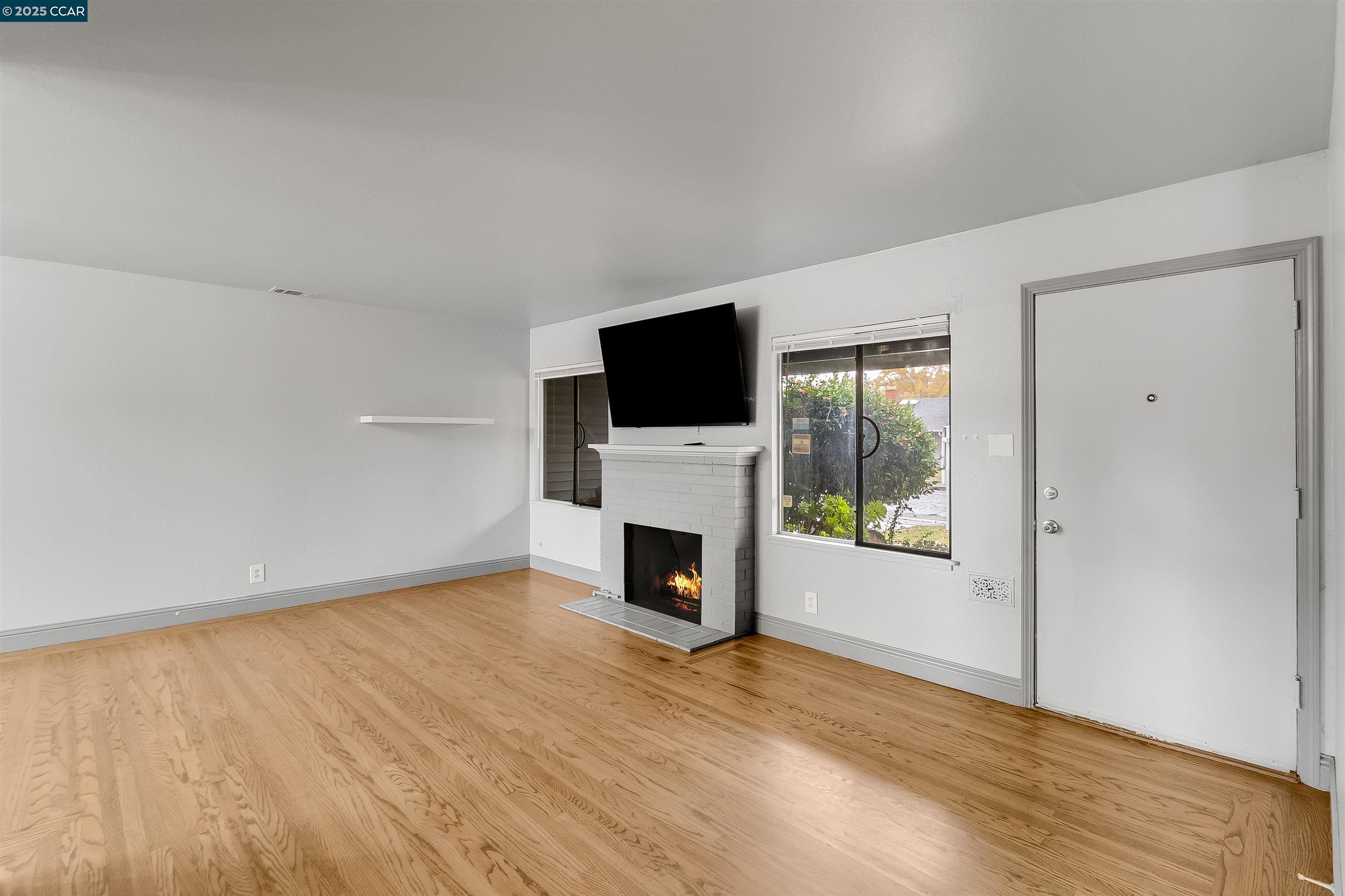 1216 Lincoln Street Fairfield, CA 94533 - Photo 17 of 28 a view of a livingroom with an empty space and a fireplace