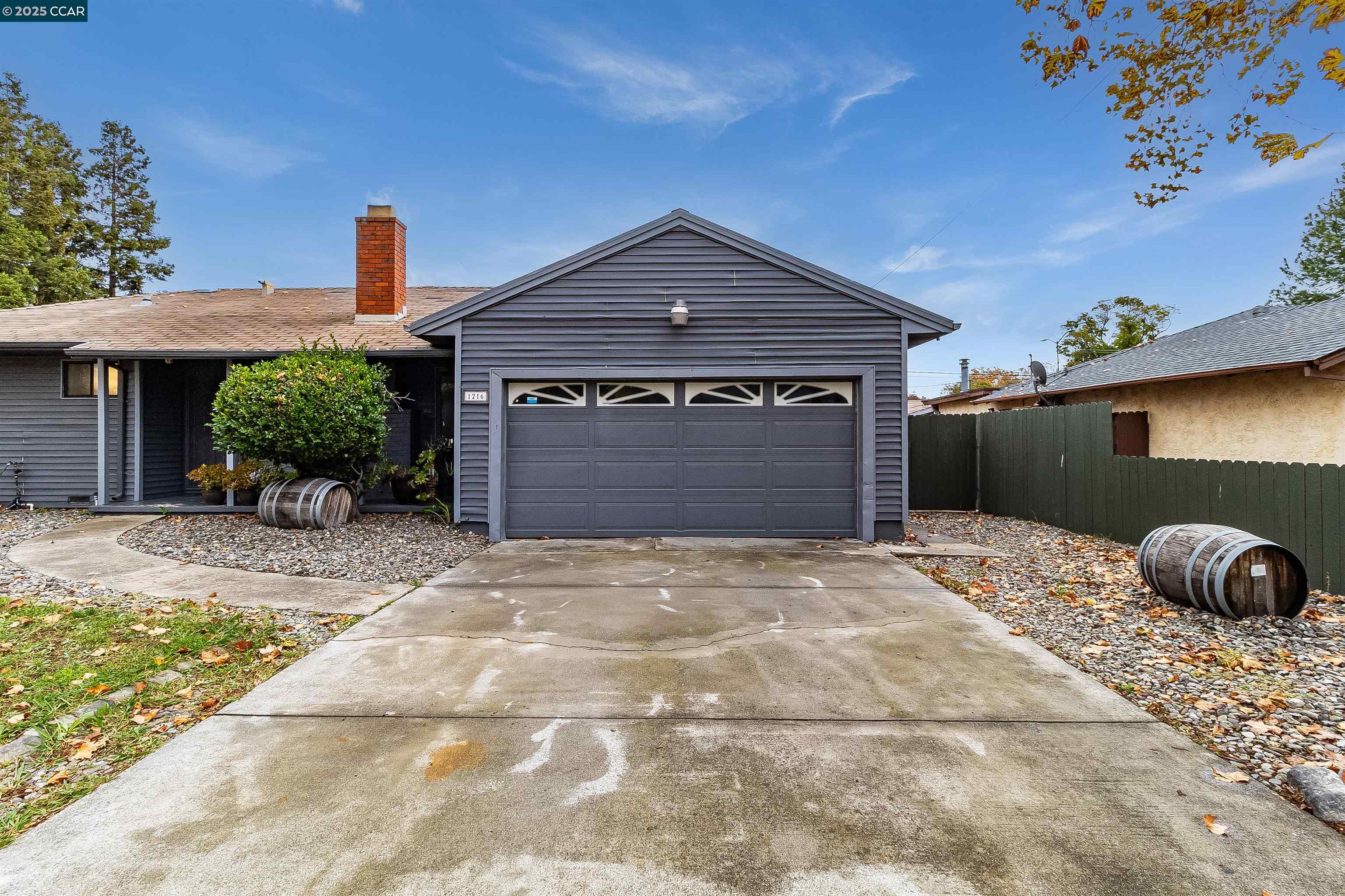 1216 Lincoln Street Fairfield, CA 94533 - Photo 24 of 28 a front view of a house with a yard and garage