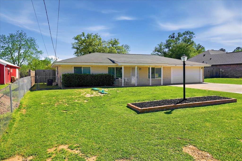 12657 Alma Street Tyler, TX 75704 - Photo 34 of 36 a front view of a house with a yard