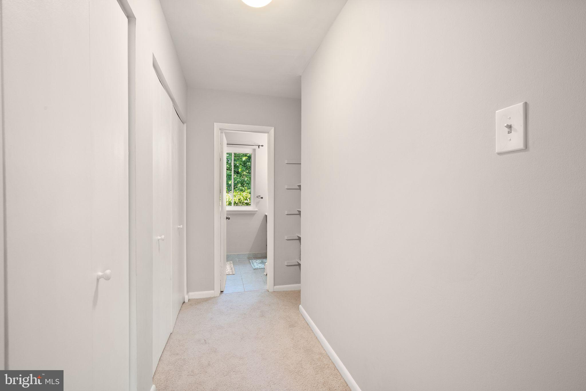11041 Saffold Way Reston, VA 20190 - Photo 26 of 44 Primary Bedroom Closets and Hall to Bathroom