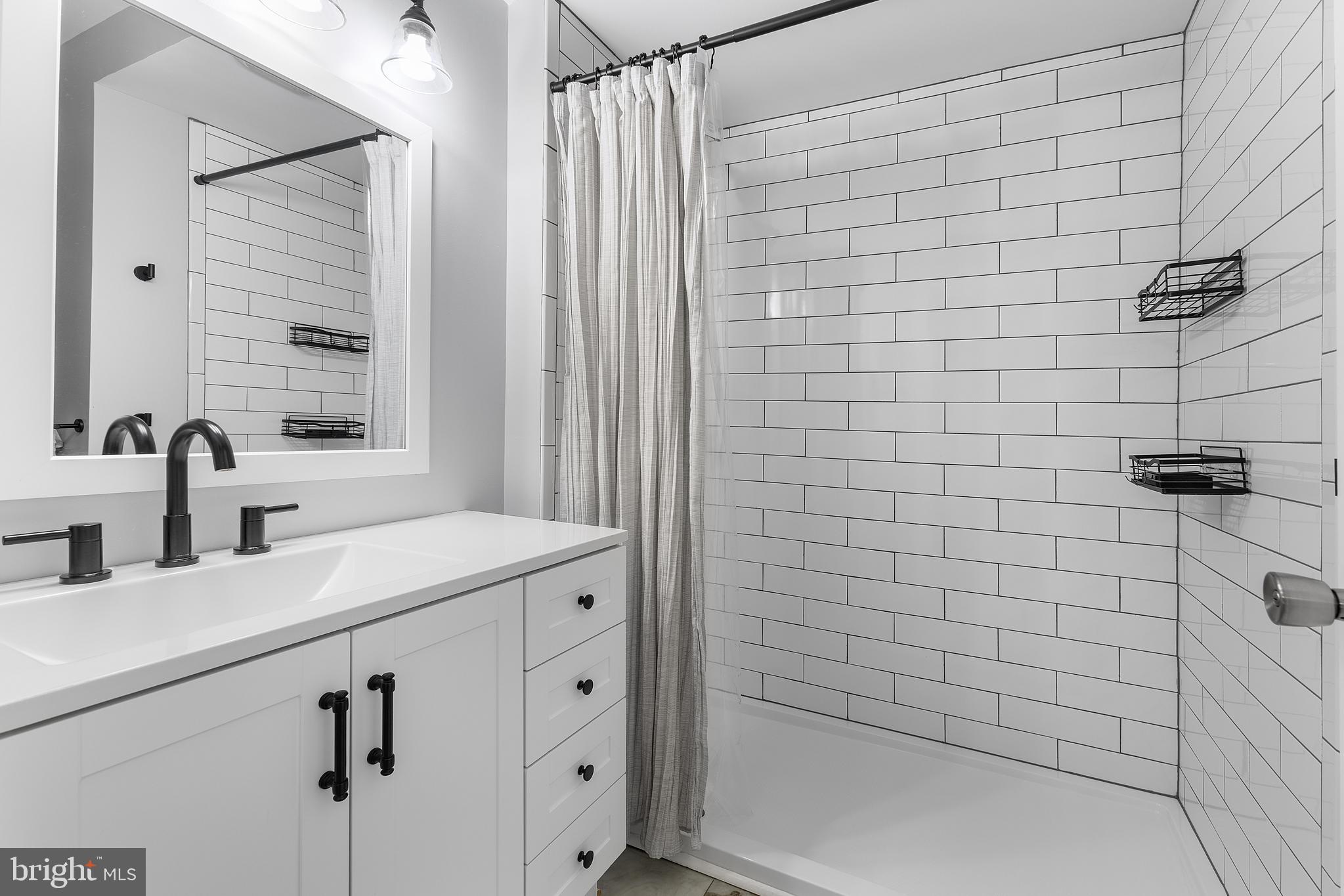 25485 Hignutt Road Denton, MD 21629 - Photo 25 of 52 a bathroom with a sink and a shower