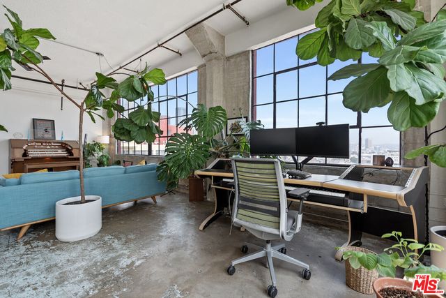 a view of a patio with table and chairs and potted plants