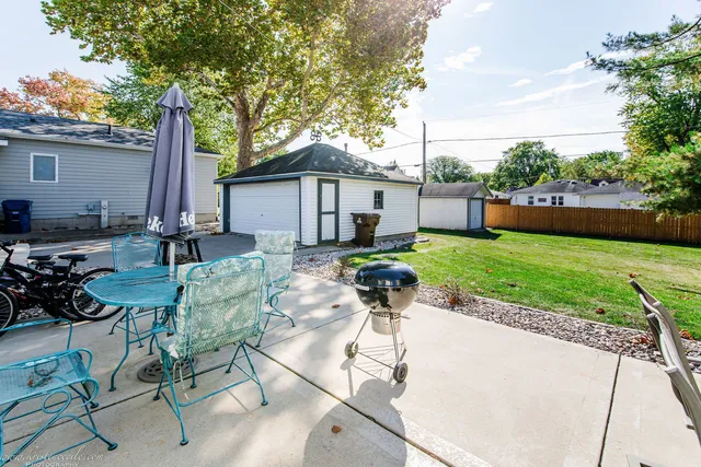 a house view with a sitting space and garden