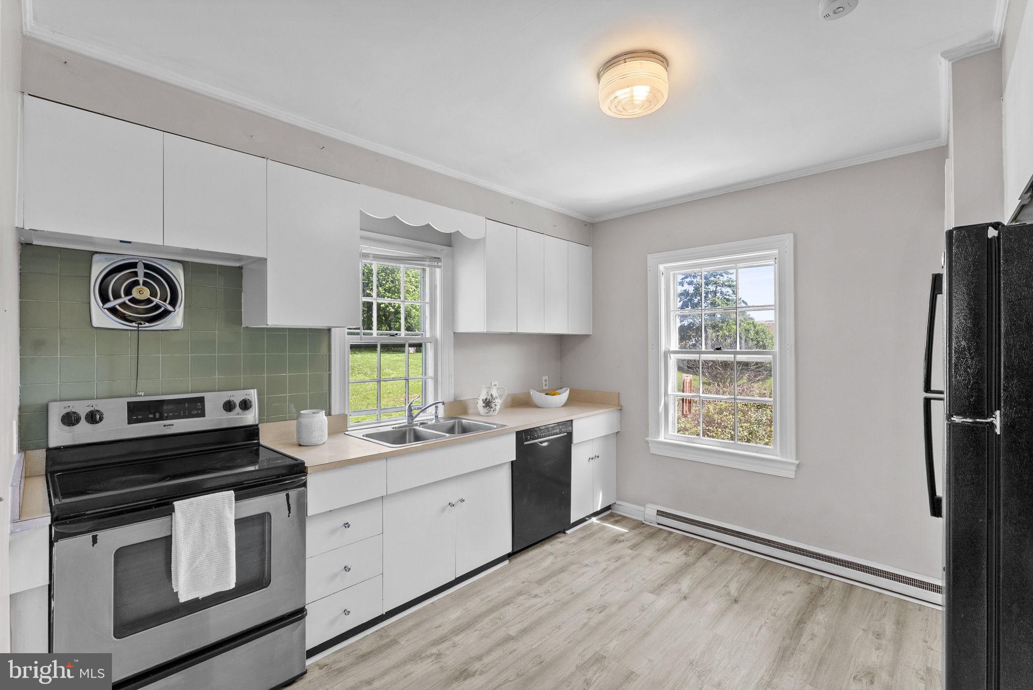 539 Old Meetze Road Warrenton, VA 20186 - Photo 19 of 30 a kitchen with a stove and a sink