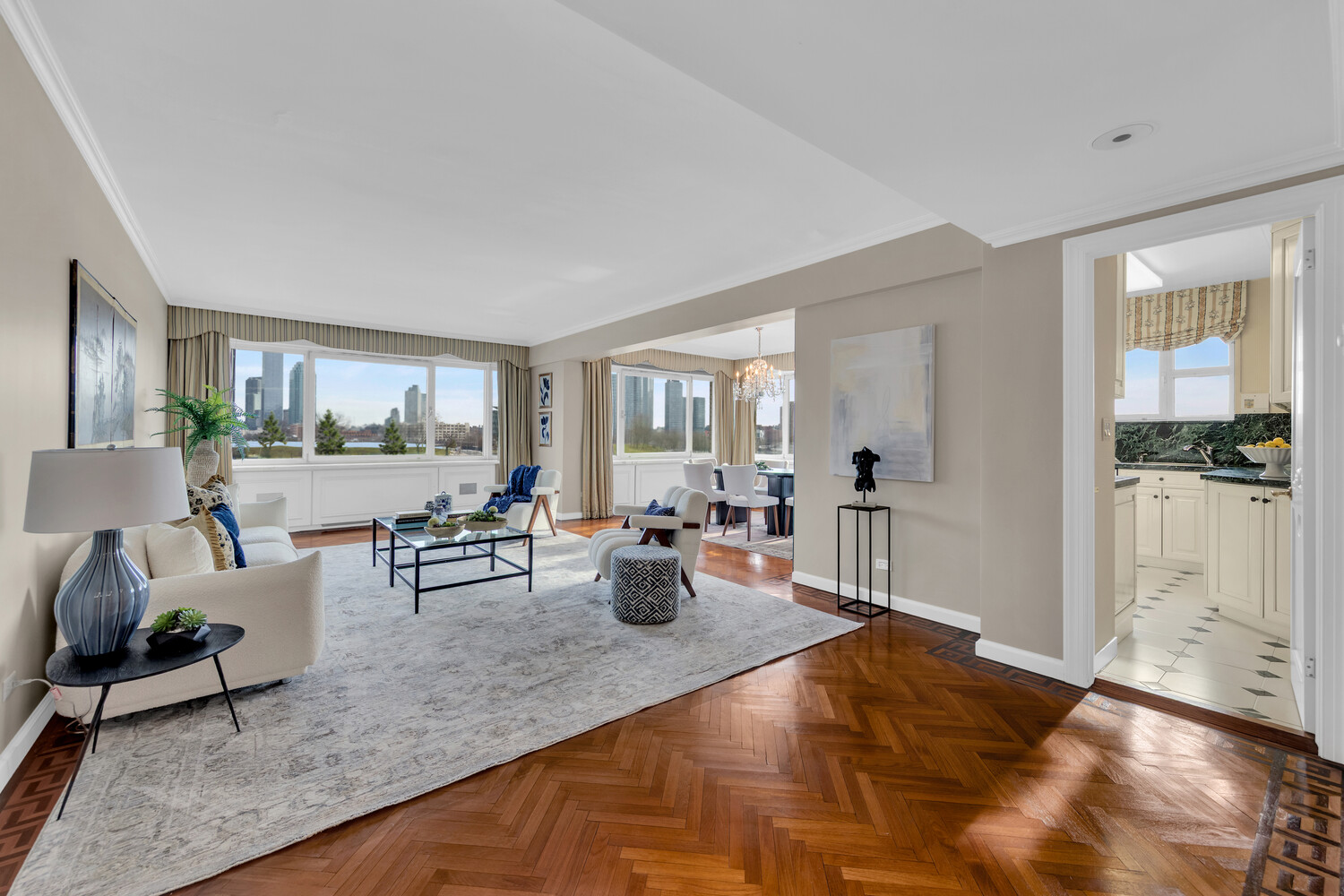 45 Sutton Place South, Unit 3FG Manhattan, NY 10022 - Photo 6 of 28 a living room with furniture and wooden floor