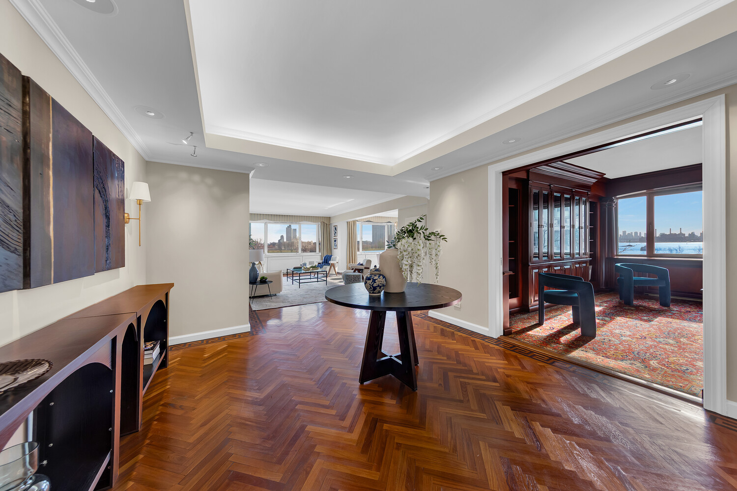 45 Sutton Place South, Unit 3FG Manhattan, NY 10022 - Photo 7 of 28 a view of a livingroom with furniture and a fireplace