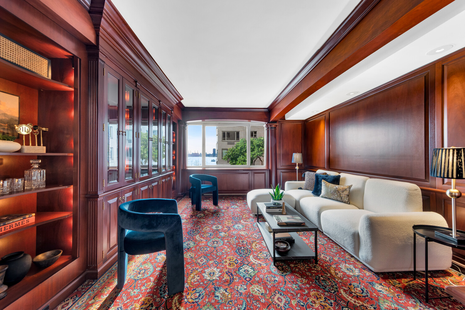 45 Sutton Place South, Unit 3FG Manhattan, NY 10022 - Photo 9 of 28 a living room with furniture and a potted plant