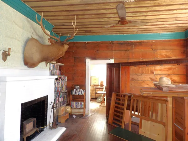 a view of a fireplace with wooden floor