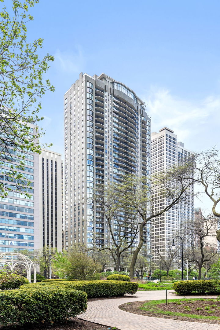 1040 North Lake Shore Drive, Unit 4C Chicago, IL 60611 - Photo 1 of 31 a view of a building with a yard