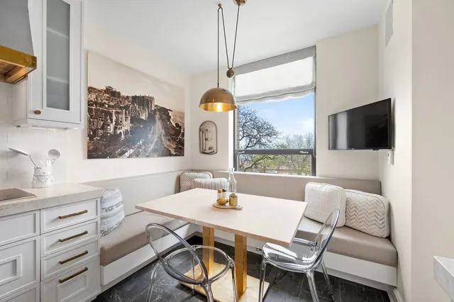 a dining room with furniture and window