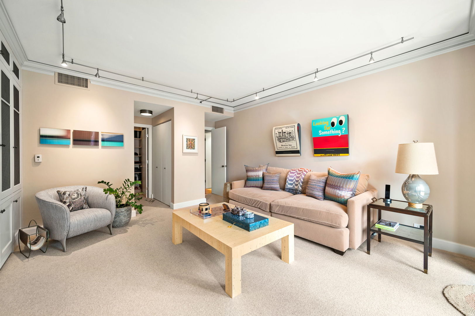 1040 North Lake Shore Drive, Unit 4C Chicago, IL 60611 - Photo 23 of 31 a living room with furniture and a table