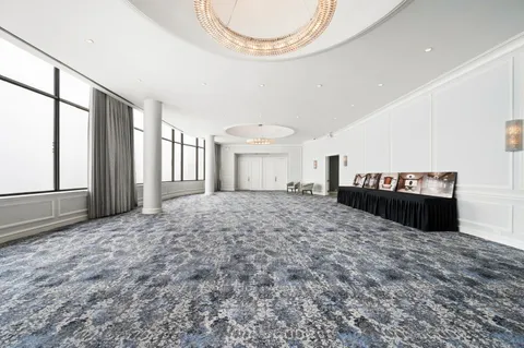 a view of a bedroom with window and furniture