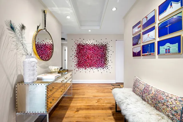 a view of a bedroom with furniture and window