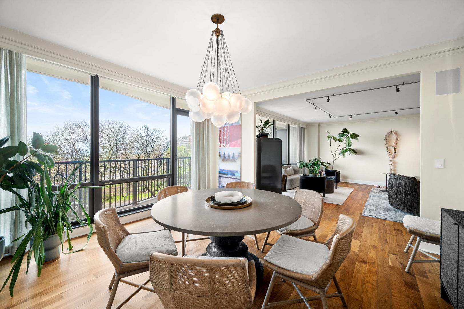 1040 North Lake Shore Drive, Unit 4C Chicago, IL 60611 - Photo 8 of 31 a view of a dining room with furniture window and wooden floor
