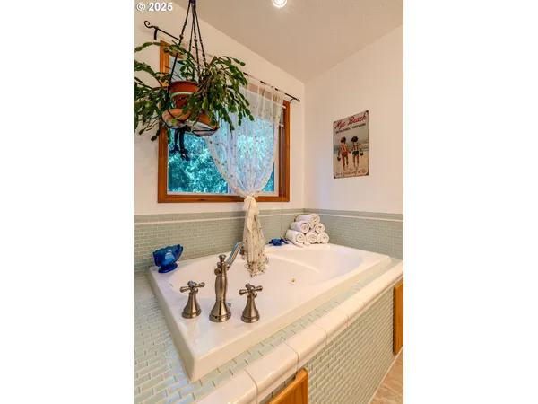 a bathroom with a sink and a window