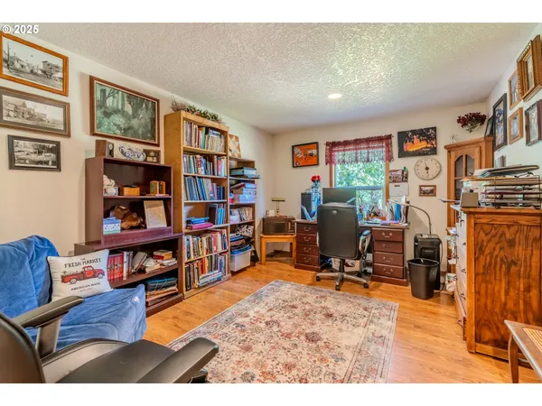 a view of living room with furniture and book shelf