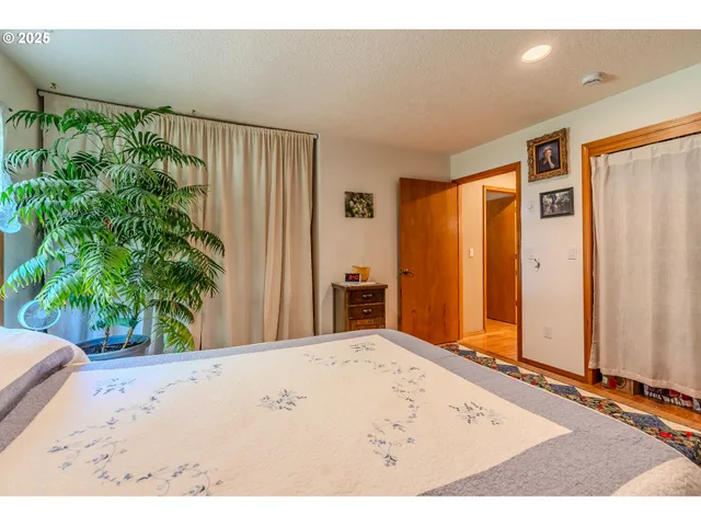 a bathroom with a sink mirror and a shower
