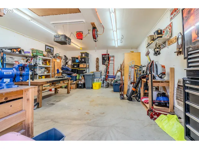 a view of a porch with a table and chairs