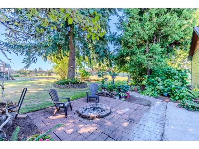 a view of yard with patio