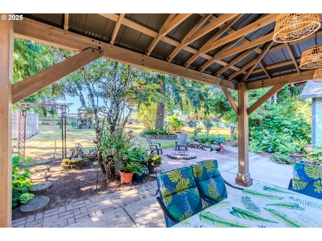 a view of a backyard with sitting area