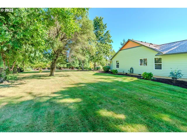 an aerial view of residential houses with outdoor space and swimming pool