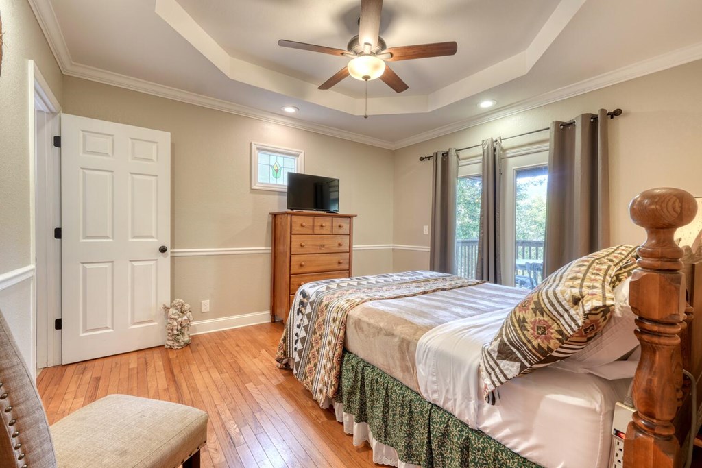 3204 Creekview Road Hiawassee, GA 30546 - Photo 12 of 45 a bedroom with a bed and wooden floor