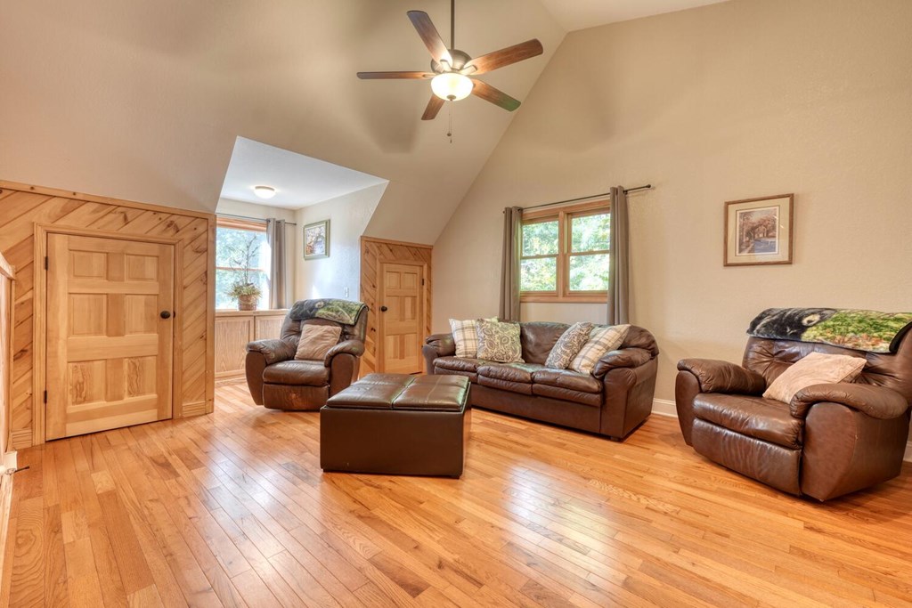 3204 Creekview Road Hiawassee, GA 30546 - Photo 17 of 45 a living room with furniture and a wooden floor