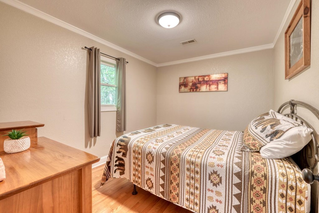 3204 Creekview Road Hiawassee, GA 30546 - Photo 20 of 45 a bedroom with a bed and a window