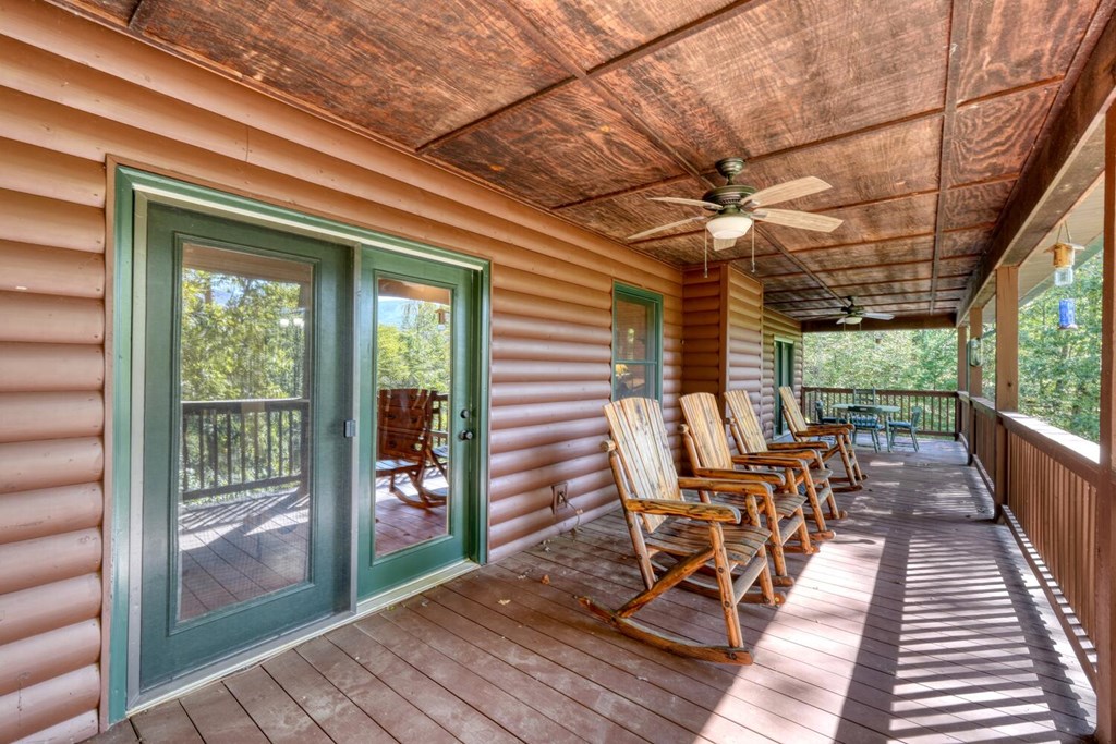 3204 Creekview Road Hiawassee, GA 30546 - Photo 41 of 45 a balcony with chairs and wooden floor