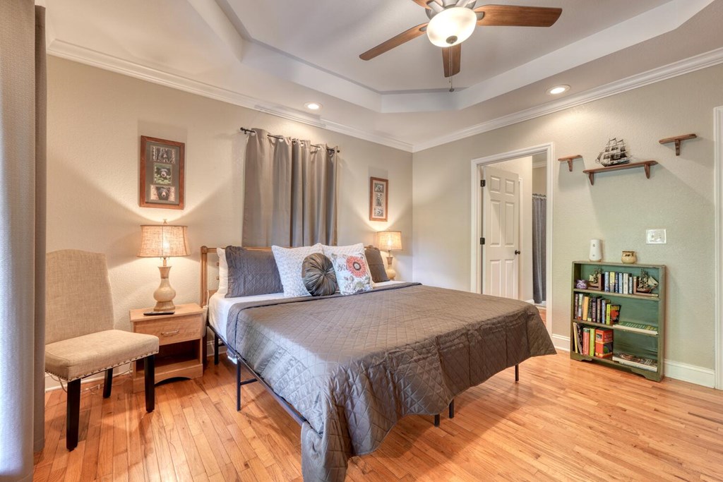 3204 Creekview Road Hiawassee, GA 30546 - Photo 8 of 45 a spacious bedroom with a bed and a chandelier
