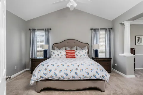 a bedroom with a bed and window