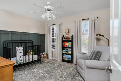 a bedroom with furniture and a window
